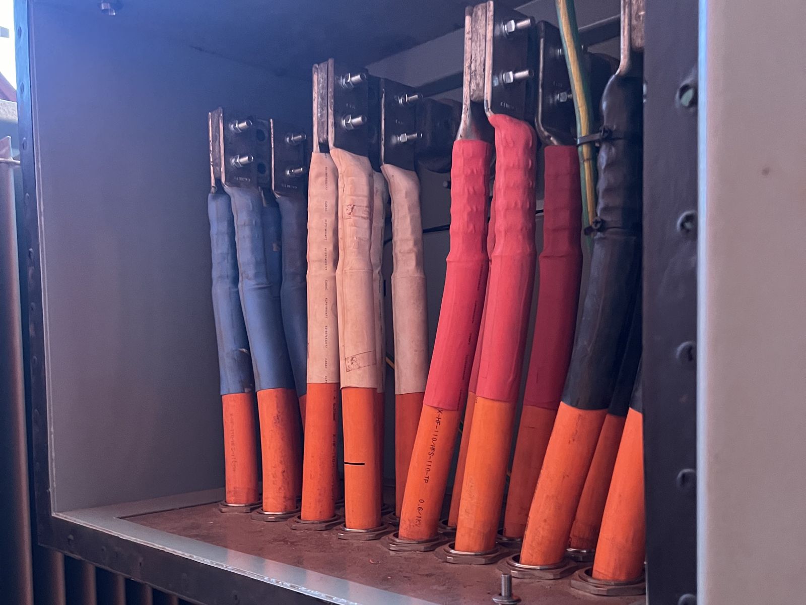 Terminated power cables in an enclosure