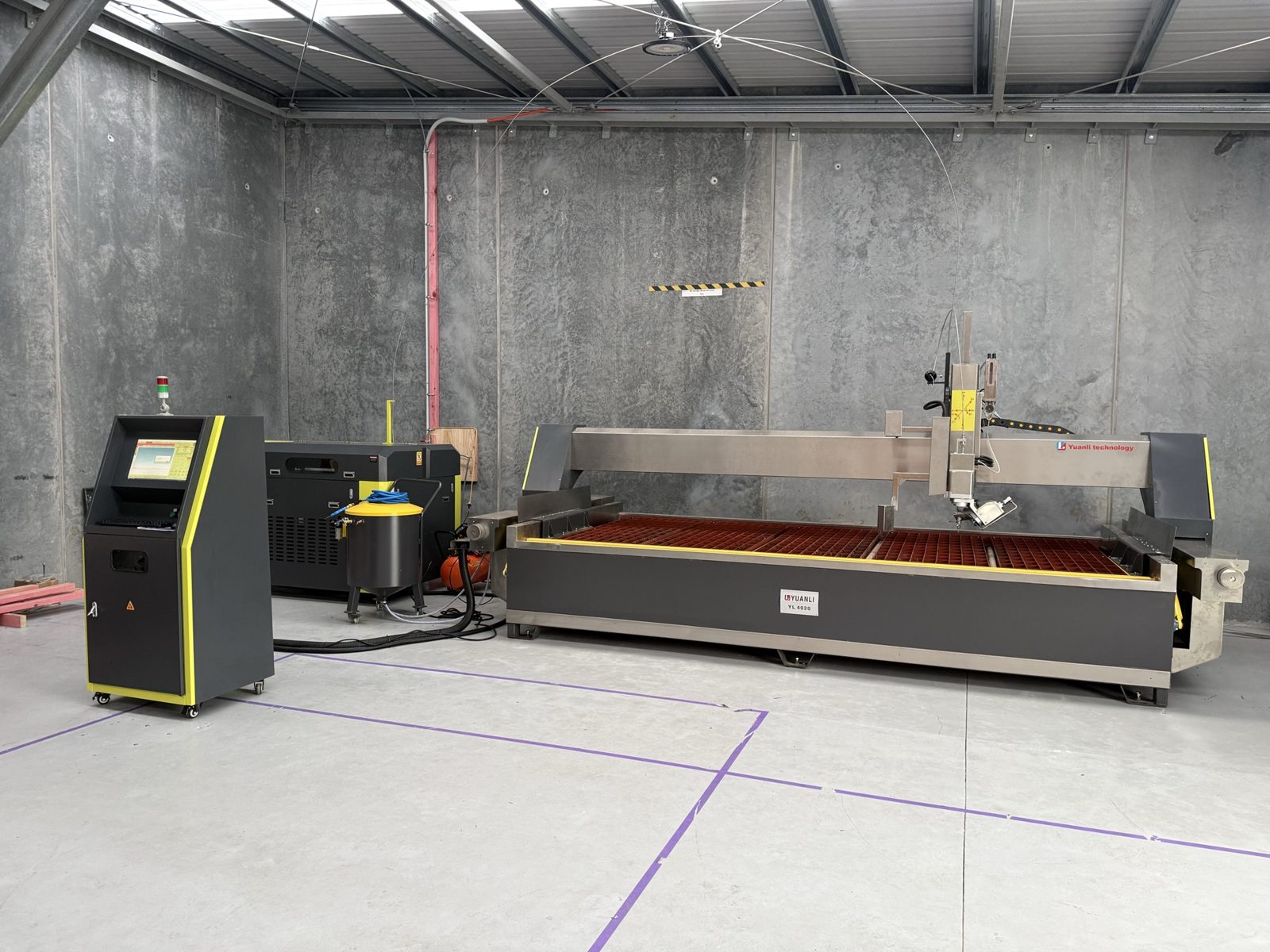 Five-axis waterjet cutting machine in the workshop